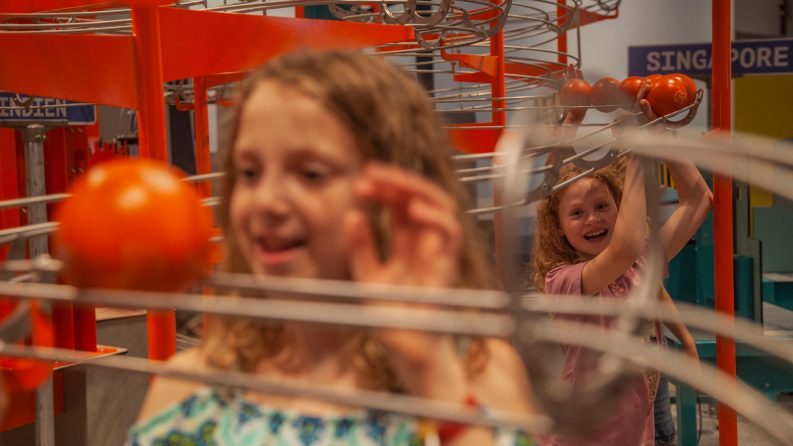 Children experimenting at an interactive exhibit at Experimentarium